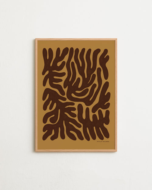 Framed abstract art print with brown leaf-like shapes on a beige background