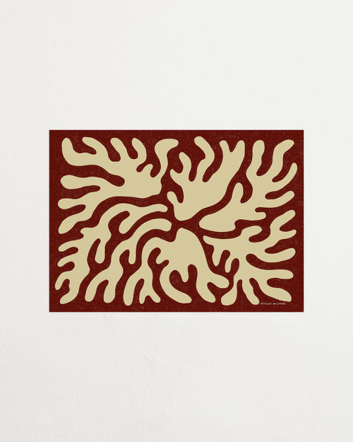 Decorative mat with abstract beige design on a red border against a white background