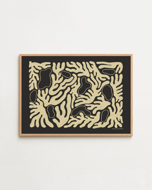 Framed abstract artwork with black and beige patterns on a white background