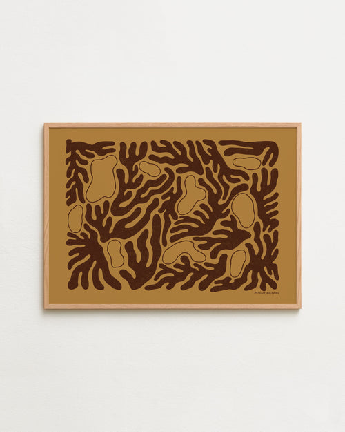 Framed abstract artwork with brown and black patterns on a beige background