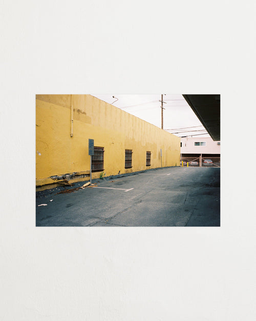 Yellow building with a street in front on a white background